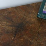 Abused and tossed table re vived with a Faux Granite tabletop transformation by Ellen Leigh
