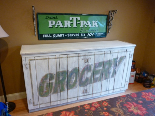 Distressed furniture: cabinet made to look like an old sign