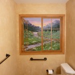 Window Mural painted on a bathroom wall. Mountainous meadow and stream on view. Mural by Ellen Leigh
