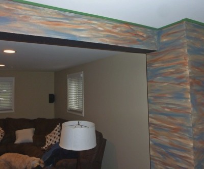 Layers of color pulled from the real stacked stone of the fireplace are the start in painting the rocks by Ellen Leigh