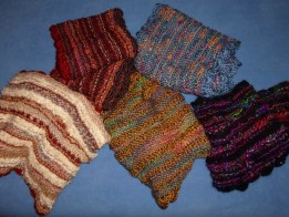 Colorful and knitted scarves using a variety of different yarns and stitches by Ellen Leigh.