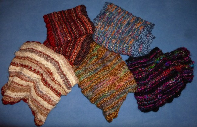 Colorful and knitted scarves using a variety of different yarns and stitches by Ellen Leigh.