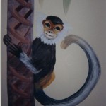 In a jungle themed room, this monkey smiles out as he climbs a banana tree. Mural by Ellen Leigh