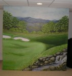 Hole Number 12 mural of a golf course and hole 12, rocky stream in the foreground. Mural by Ellen Leigh