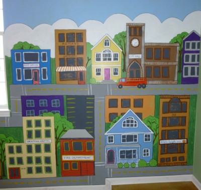 A cartoonish town for the young 5's at the day care. Mural by Ellen Leigh.