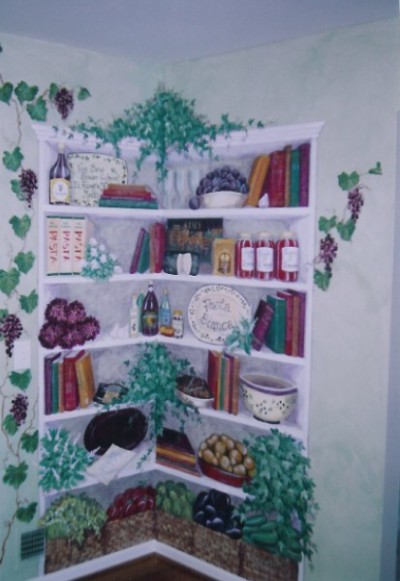 Corner Shelves with family favorite items and books, softly colorwashed walls and grapevines. Mural by Ellen Leigh