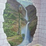 Stone block walls on two walls broken away to reveal a princess tower, mountains and a waterfall. Every little girl wants this. Mural by Ellen Leigh