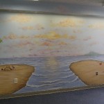 Beach scene in pediatric playroom. All walls painted with various Great Lakes region beach scenes, floral and fauna. Mural by Ellen Leigh