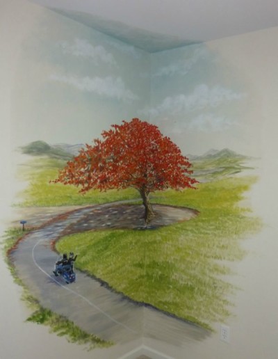 A favorite tree from the owner's memories of Puerto Rico, the Flamboyan Tree. Nursery wall mural with scenery and the couple on their motorcycle. Mural by Ellen Leigh