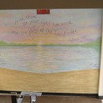 Landing wall at the parking lot door. Water scene and bible verse. Mural by Ellen Leigh