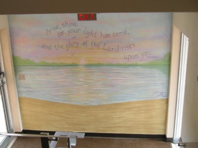 Landing wall at the parking lot door. Water scene and bible verse. Mural by Ellen Leigh