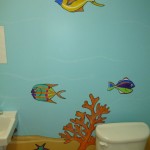 Plenty of tropical fish cartoons in the kids' bathroom at the day care. Mural by Ellen Leigh.
