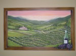 Tuscan Window mural painted to look as though overlooking the Tuscan countryside, owner's home made wine on the window sill. Mural by Ellen Leigh